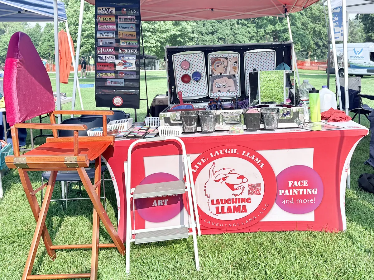 Face painting setup at an event, representing the practical side of service delivery.