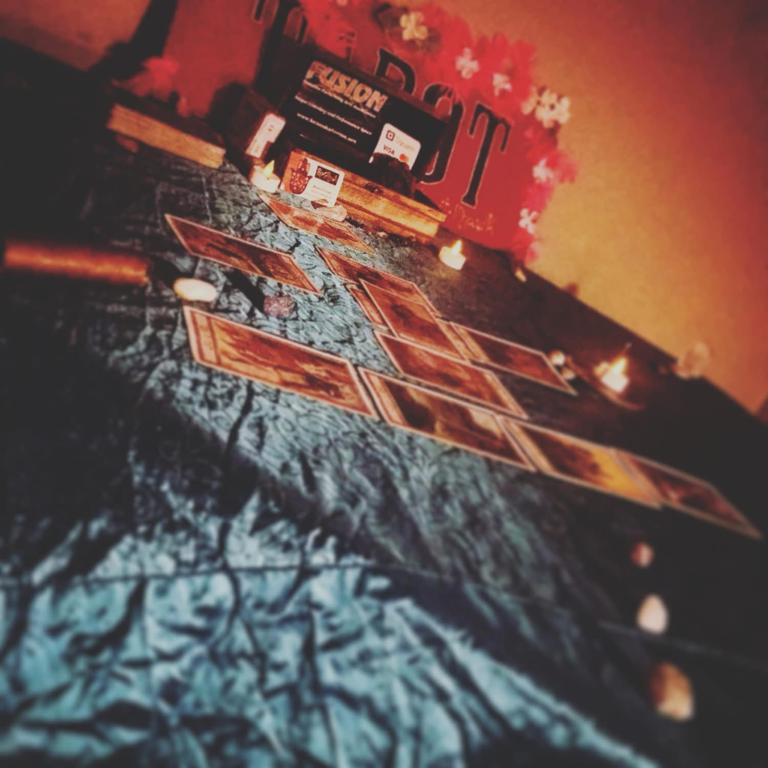 Artistic tarot card spread arranged for a Laughing Llama reading in Southeastern Wisconsin.